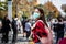 Asian Young woman walking in the city wearing protection mask on face because of air pollution, particulates and for protection