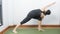 Asian young woman wear a black yoga outfit . Practicing yoga Standing Asanas Action PARIVRITTA PARSVAKONASANA Revolved side angle