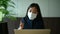 Asian young woman wears face mask working with computer in office. Stress and disappointment emotion