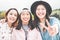 Asian young women friends having fun outdoor - Happy trendy girls laughing together - Millennial generation, bonding, friendship