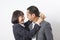 Asians executive businessman and businesswoman smile and hugging