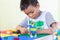 Asianâ€‹ childâ€‹ boyâ€‹ playingâ€‹ withâ€‹ theâ€‹ plasticâ€‹ blockâ€‹ toys.â€‹