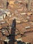 Asinelli tower shadow over Bologna red brick roofs