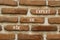 Ask an expert symbol. Concept words Ask an expert on white paper on brick wall. Beautiful brick wall background. Business and ask