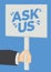 Ask us message on a placard banner against a blue background. Concept of customer service, consumerism or marketing