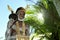 Asmat tribesman with drum.The In the village of Asmates goes preparation for of a ceremony of Doroe.