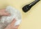 ASMR concept. Specific auditory irritants. Woman`s hands wrinkle plastic wrap in front of a microphone. Top view, flat lay