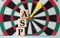 ASP - acronym on wooden cubes on dartboard background