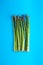 Asparagus on a bright blue background.