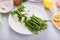 Asparagus cooked on a plate topped with parmesan