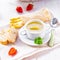 Asparagus cream soup with capers and fresh baguette
