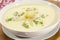 Asparagus cream soup in a white bowl