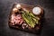 Asparagus eggs bacon and garlic on butcher board. - top of view