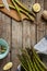 Asparagus in rural kitchen - preparing to cook on vintage wooden table