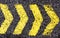 Asphalt arrow yellow sign