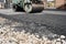 Asphalt Compactors is carrying out road repair work. Laying new asphalt. Large heavy machinery. Construction of a new