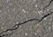 Asphalt with crack background. Old gray road for background or texture.