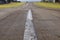 Asphalt details of an airfield runway countryside