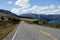 Asphalt highway curve road to mountain cook New Zealand with clo