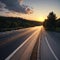 an asphalt highway road and sky sunset clouds.