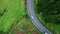 Asphalt highway stretching nature drone top view. Cars traveling forest roadway