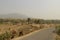 Asphalt path through the landscape plateau