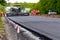 Asphalt paver on the road during asphalt laying in defocus. Road repair. Laying a new road