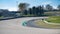 Asphalt racetrack turn and curbs with formula cars racing motor sport