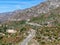 Asphalt road bends through Angeles National forests mountain, California, USA.