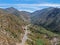 Asphalt road bends through Angeles National forests mountain, California, USA.