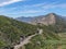 Asphalt road bends through Angeles National forests mountain, California, USA.