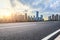 Asphalt road and Chongqing cityscape at sunset