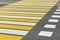 Asphalt road crosswalk with marking lines white and yellow stripes