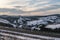 Asphalt road curve and winter beginning in Mountains, Ukraine, Carpathian