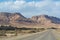 Asphalt road in desert Negev, Israel, road 40, transport infrastructure in desert, scenic mountains route in Mizpe Ramon canyon i