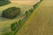 Asphalt road among fields. Photo from the drone.