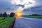 Asphalt road among the forest at sunset. Roads of Russia