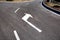 Asphalt road, fork. Sign arrow turn right on the asphalt in white. Sunny day. Horizontal orientation