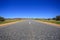 Asphalt road, gravel close up. Perspective view