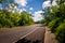 Asphalt road in green forest - Yucatan, Mexico