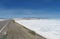 Asphalt road through huge salt lake