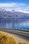 Asphalt Road Lake And Mountain Range Background