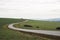 Asphalt road in landscape with field and meadow, in Czech Republic, Moravia