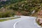 Asphalt road. Landscape with rocks and beautiful mountain road with a perfect asphalt. Vintage toning. Travel background