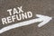 On the asphalt road markings an arrow with the inscription - TAX REFUND