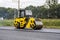 Asphalt road roller with heavy vibration roller compactor press new hot asphalt on the roadway on a road construction