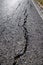 Asphalt road surface crack. Save the planet