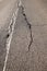 Asphalt road surface crack. Save the planet
