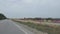 Asphalt road with temporary plastic fences.