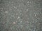 Asphalt road texture, close up view. Grey asphalt background. Grey pavement structure. Road surface patern, closeup